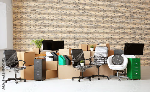 Carton boxes with stuff in empty room. Office move concept фототапет