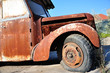 Old rusty bus abandoned at the edge of the road. 