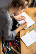 © Alexander - young woman studying and handwriting