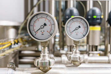 Pressure gauge, measuring instrument close up on pneumatic control system.