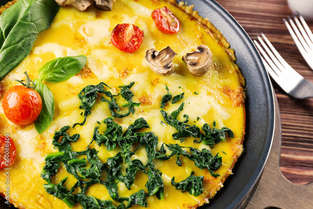 Tasty frittata with spinach, closeup