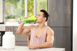 © Africa Studio - Sporty young man drinking protein shake in kitchen