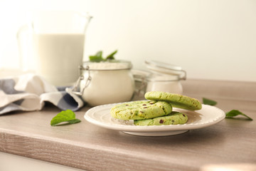 Wall Mural - Plate with mint chocolate chip cookies on table in kitchen