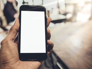 image of man's hand is holding a black cell phone with blank white screen that you can put any ideas