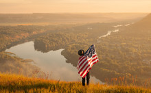 Man With USA Flag In Nature