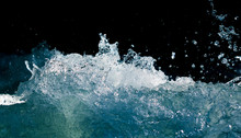 Splash Of Stormy Water In The Ocean On A Black Background