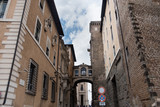 Fototapeta Uliczki - Foreshortening of a narrow street in Rome, Italy