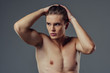 © Vasyl - Handsome man on grey background