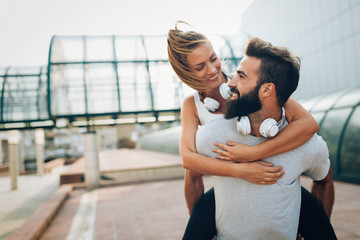 Portrait of young attractive happy fitness couple