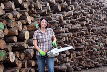 Portrait Of A Woman With A Chainsaw