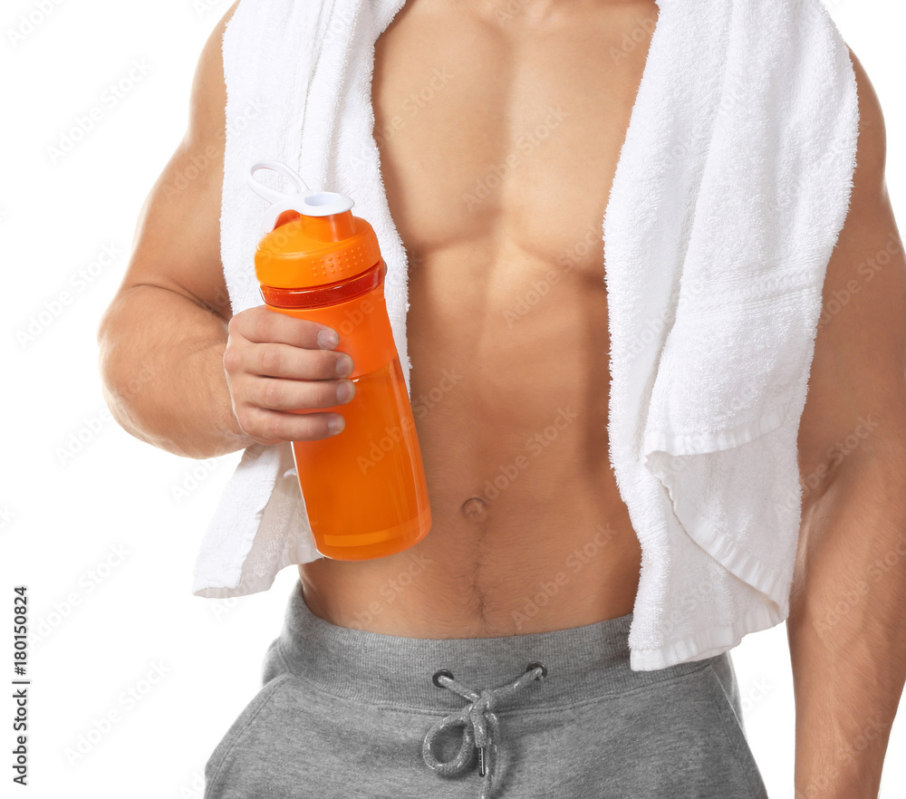 Sporty young man with protein shake on white background