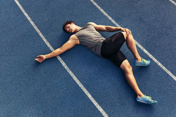 Wall Mural - sprinter warming up on the track