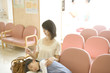 © amanaimages - Mother and daughter in clinic waiting room