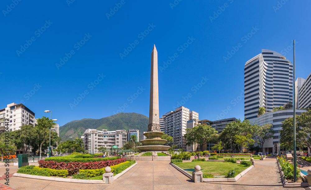 Panoramic view of Altamira's Obelisk on a sunny day with blue skies in Francia Square (A.k.a. Plaza Altamira), in venezuelan capital city Caracas, in 2017.