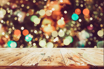 Wall Mural - christmas background and blurred light bokeh with empty wooden deck table for product montage. rusti