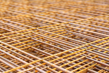 Steel bars for reinforced concrete. Closeup of Steel Bar. Geometric alignment of Re bars on construction site. Rusty is iron rust