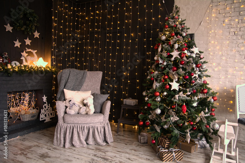 Interior Of The Room With A Christmas Tree And A Fireplace