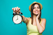 © F8  \ Suport Ukraine - Smiling beauty woman holding alarm watch at 8 oclock. Isolated portrait.