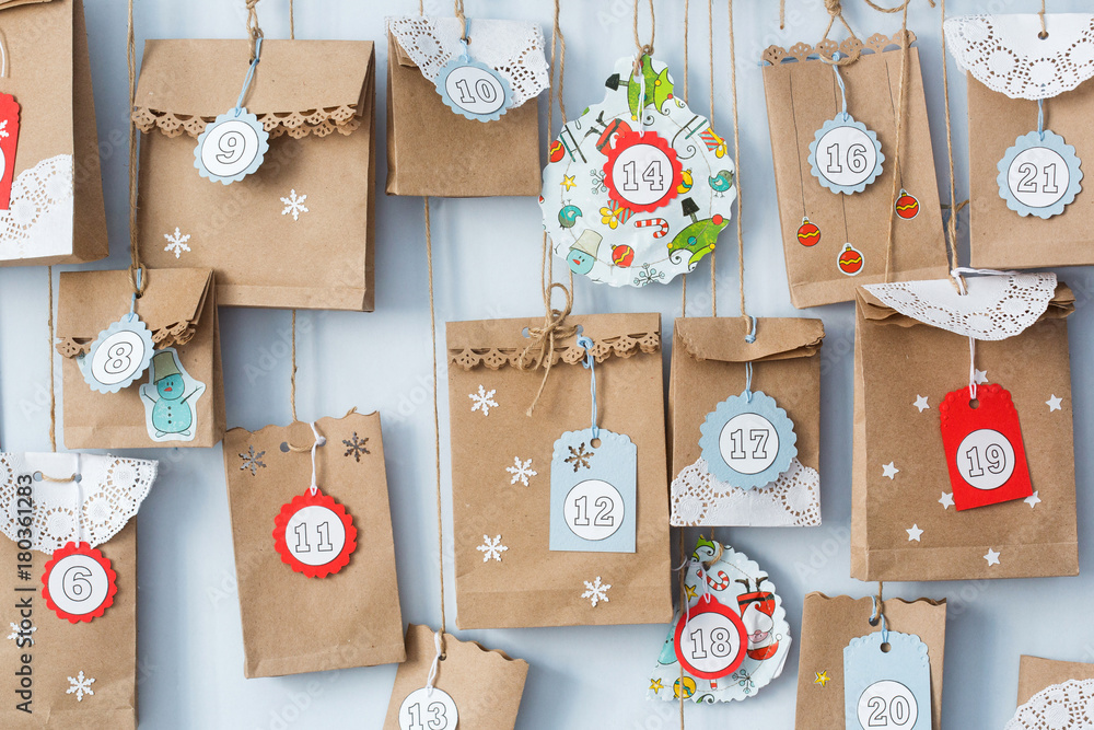 фотография advent calendar with small gifts close up