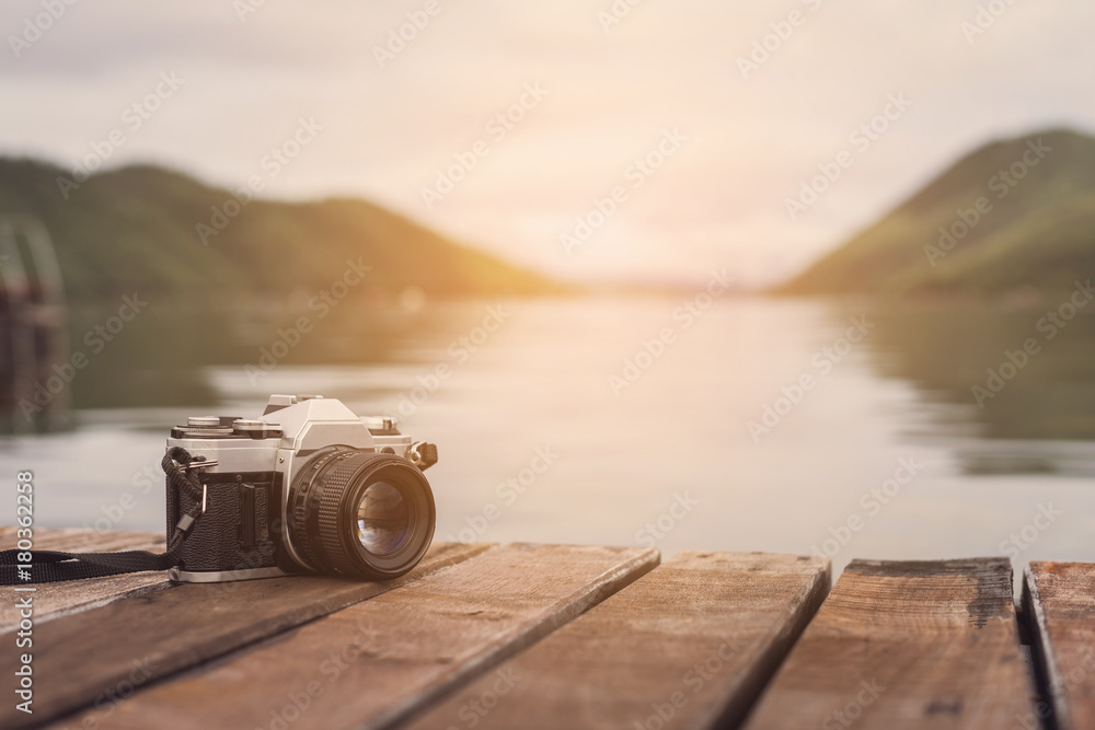 Retro camera with beautiful landscape - obrazy, fototapety, plakaty 