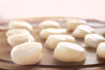 Sticker - Wooden board with raw scallops, closeup