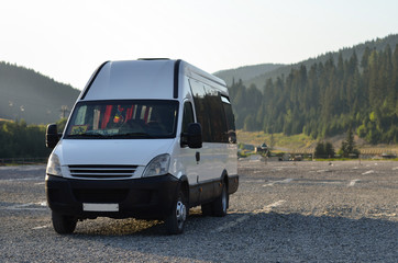 passenger bus van parked on a mountains parking