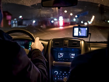 Man, Driving A Car At Night