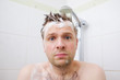 © RealPeopleStudio - Worried caucasian foamed young man after the water in the shower was turned off, looking at the camera.