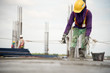 © bannafarsai - Construction worker Concrete pouring during commercial concreting floors of building in construction site and Civil Engineer