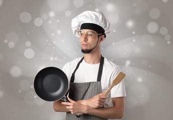 Male cook with shiny grey wallpaper