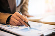 © Freedomz - Business Financing Accounting Banking Concept, businesswoman doing finances and calculate about cost to real estate investment and in other, tax system