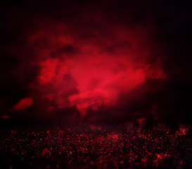 black and red glitter lights background. defocused