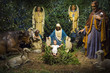 Christmas nativity scene with Mary, Joseph, the Angel Gabriel and animals looking down on baby Jesus in his manger