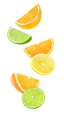 Isolated falling citrus pieces. Slices of orange, lemon and lime floating in the air isolated on white background with clipping path