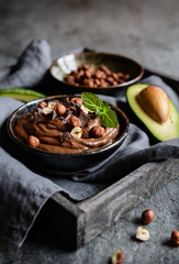 Wall Mural - Raw avocado chocolate mousse with hazelnuts