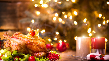 Wall Mural - Christmas dinner. Decorated holiday table with roasted chicken