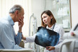 © pressmaster - Senior patient worried by results of x-ray exam listening to his doctor advice