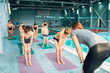 © Nomad_Soul - Instructor kids doing exercises before swimming