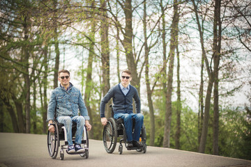 Wall Mural - Disabled Happy friends having fun together outside.