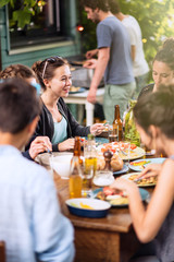 Group of students having fun while they prepare a bbq