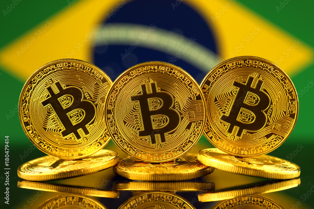 Physical version of Bitcoin (new virtual money) and Brazil Flag. Conceptual image for investors in cryptocurrency and Blockchain Technology in Brazil.