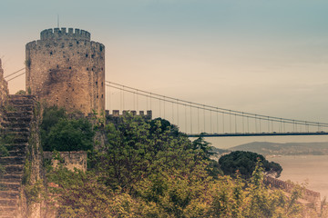 Wall Mural - View of Rumelihisar is a fortress located in the Istanbul, Turkey on a hill at the European side of the Bosphorus. Old photo style.