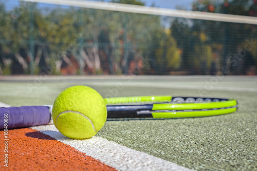 macro tennis ball and racket on hard court Poster