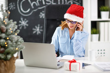 Businesswoman Freelancer Working At A Computer At Christmas