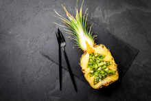 Holiday Diet Concept Or Tropical Christmas Menu Concept. Christmas Tree Made From Pineapple And Kiwi On Slate Board. Ideas For Christmas New Year Menu.