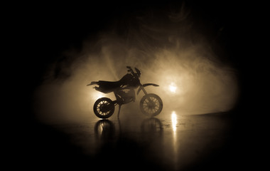 Wall Mural - High power motorcycle chopper. Fog with backlights on background with man rider at night