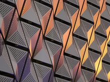 Modern Steel Angular Geometric Cladding With Colour Tones And Perforated Patterned Design