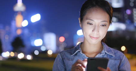 Sticker - Woman use of cellphone in city of Hong Kong