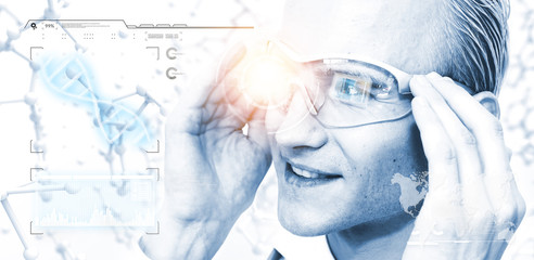 Smart scientist using smart glasses with augmented reality technology. HUD science graphics background. Blue light tone image.