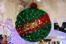 Seasons Greetings Text Decorated On Green Red Christmas Decoration Tree Ball